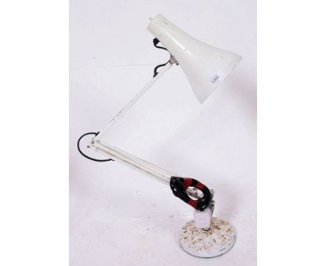 A mid 20th century Herbert Terry Anglepoise Lighting Company adjustable lamp having a circular base in a white finish. 80cm T