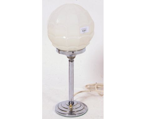 An Art Deco 1930's lamp, with stepped chrome base and a good original 1930's shaped globe to top. 