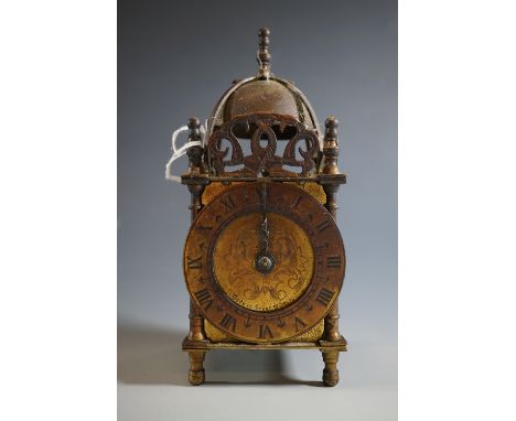 A brass electric lantern clock