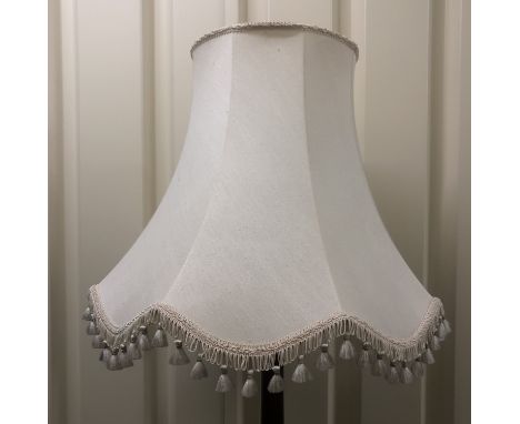 A 1940's turned mahogany standard lamp