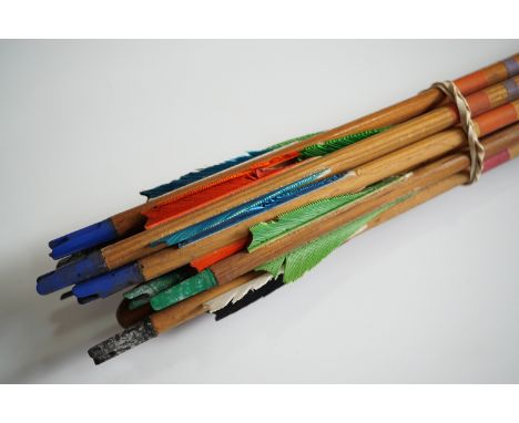 A vintage sporting flat bow and arrows