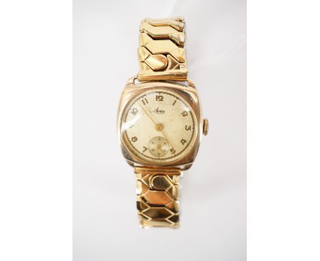 A gentleman's 9ct gold cased Avia wristwatch, with Arabic numerals and a subsidiary seconds dial, in a cushion shaped case, o