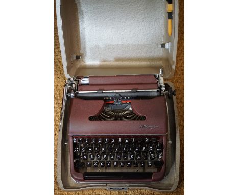 An Olympia portable typewriter, cased