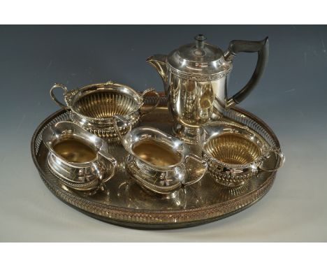 An electroplate galleried tray, a Walker and Hall cream jug and sucrier, and a Viners coffee pot, cream jug and sugar