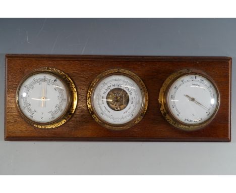 A bulkhead style barometer and thermometer / hygrometer