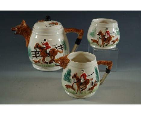 A tea set decorated with fox hunting scenes