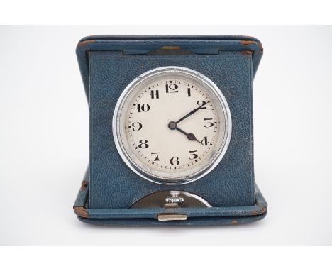 An early 20th Century blue leather cased travelling bedside clock