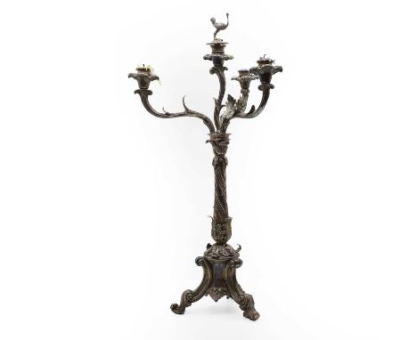 A silver plated four branch candelabra by Elkington & Co., surmounted by an ostrich finial and crested to the base the crest 