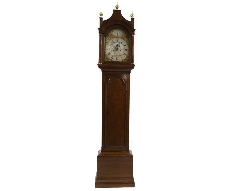 A George III eight-day oak longcase clock late 18th/ early 19th century, the brass dial with silvered chapter ring and engrav
