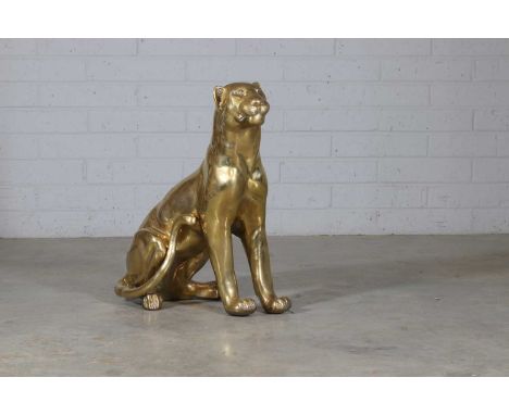 An Art Deco-style brass model of a jaguar, 20th century, modelled seated on its haunches,37cm wide65cm deep77cm highCondition