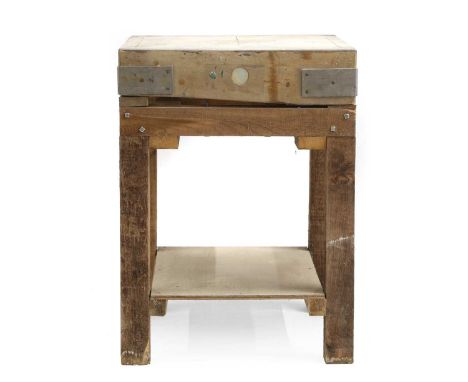A butcher’s block board, on a later stand,61cm square 83cm highFrom the contents of Brook House, Ongar, the former home of Gi