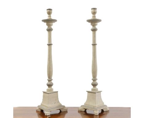 A pair of Swedish Baroque-style painted wooden candlestick holders, of recent manufacture, each turned column on a triform ba