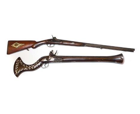 An Indian flintlock blunderbuss,  19th century, with an iron barrel with flared muzzle, with dog tooth mother of pearl inlaid
