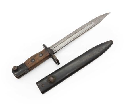 A Lee Enfield bayonet,  the single edge fullered blade with clipped back point, fitted two piece wooden grip stamped W/78 hou