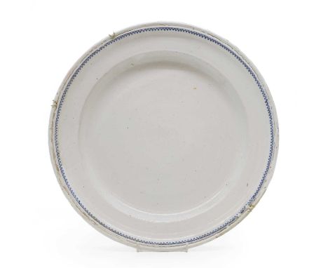 A glazed faience bowl, 19th century, French, possibly Bordeaux, with blue underglaze border,39cm wide