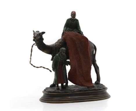 Carl Kauba (Austrian, 1865–1922) an Austrian cold-painted bronze, of a rug seller, sat on a camel, signed, 15cm wide20cm high