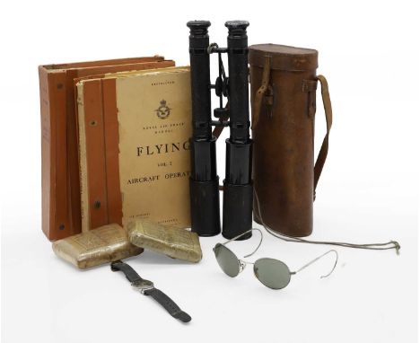 Two RAF 'Flying' manuals, Vol I & II 1954 and 1955, two field dressings, a pair of binoculars, by Negreet and Zambra, in a le