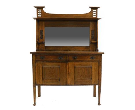 An Art and Crafts oak mirror back cabinet sideboard, c.1900, of small proportions, with embossed copper panels of windmills, 