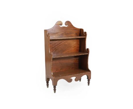 A mahogany and line inlaid waterfall bookcase, early 19th century, with scrolling break arch pediment over three shelves 65cm