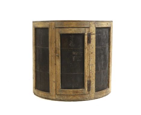 A pine demi-lune warming cabinet,  19th century, the tin panelled doors enclosing two shelves, branded WJ  115cm wide   40cm 