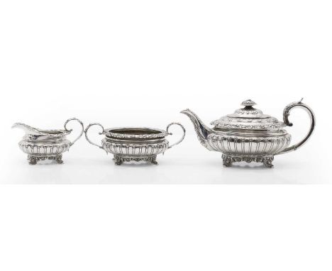 A George IV silver three piece tea service  by Rebecca Emes & Edward Barnard I, London 1828, comprising a teapot, with ivory 