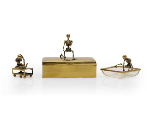 An unusual brass cigarette box, of rectangular form with skeleton surmount, 18cm wide, together with the matching ashtray and