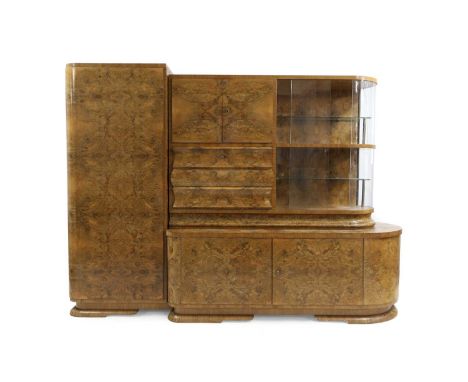 A continental Art Deco walnut cabinet, 20th century, fitted with a full height cupboard, lacking shelves, a further mirrored 