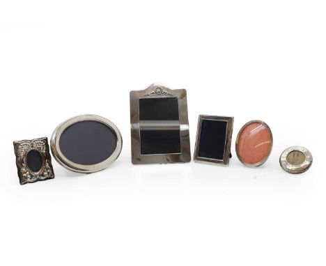 A silver photograph frame, by Kitney &amp; Co, London 1986, rectangular form with laurel and tied ribbon cresting, 9cm high, 