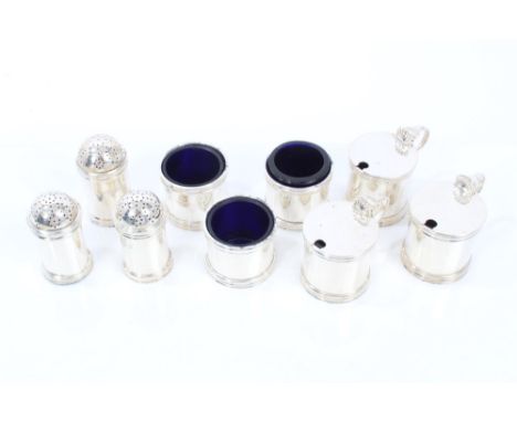 1940s silver six piece condiment set - comprising pair drum mustards with blue glass liners, pair matching salts and pair pep