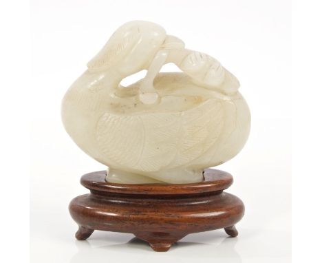 18th / 19th century Chinese carved green jade figure of duck with a water lily in its beak, on hardwood stand, 6cm   CONDITIO