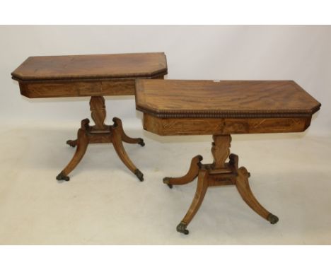 Pair of Regency mahogany and boxwood line-inlaid card tables, each with well figured crossbanded canted rectangular fold-over