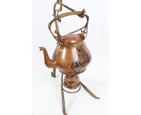 German Art Nouveau copper and brass kettle on burner stand by Carl Deffner (1856 - 1948), the kettle with black enamelled thi
