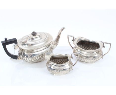 Victorian silver three piece tea set - comprising teapot of half-fluted form, with engraved presentation inscription, hinged 