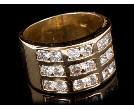 Gold and diamond ring, the wide band with eighteen brilliant cut diamonds in channel setting, on a plain polished shank.  Est