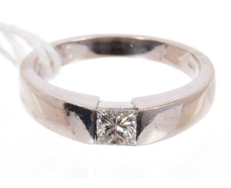 Diamond single stone ring, the princess cut diamond estimated to weigh approximately 0.45 carats, in rub-over setting, on a w