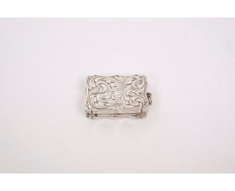 Victorian silver vinaigrette of shaped rectangular form, with suspension ring, engraved foliate decoration and initials, hing