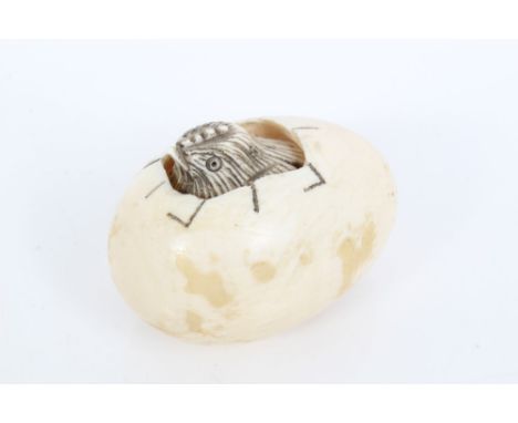 Early 20th century Japanese carved ivory netsuke of a chick hatching from an egg - signed, 4cm