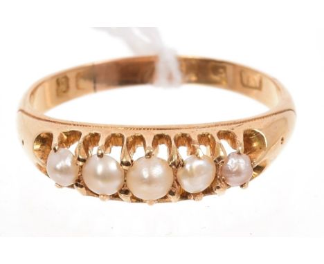 Victorian gold (18ct) seed pearl ring with five graduated half pearls in gold claw setting, on plain shank.  Ring size Q