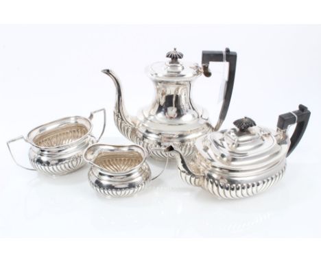 1920s silver four piece tea set - comprising teapot of half-fluted form, with angular ebony handle and hinged domed cover wit