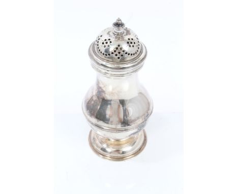 George II silver caster of baluster form, with slip-on domed pierced cover with acorn finial, on domed pedestal foot (London 