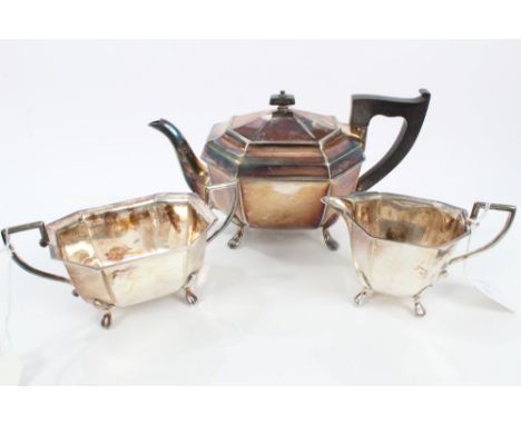 Contemporary silver three piece tea set - comprising teapot of octagonal form, with angular ebony handle and hinged cover wit