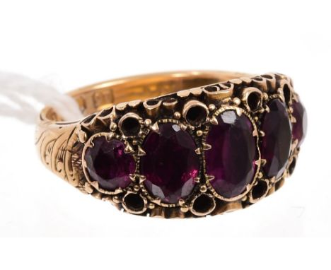 Victorian gold (15ct) garnet five stone ring, the graduated oval mixed cut garnets in closed back setting, with scrollwork de