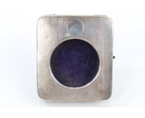 Early 20th century silver Goliath travelling watch case of rectangular form, with engine-turned decoration and vacant cartouc