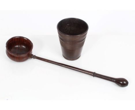 Late 18th century carved treen toddy ladle, 30cm long, together with a turned treen cup (2)