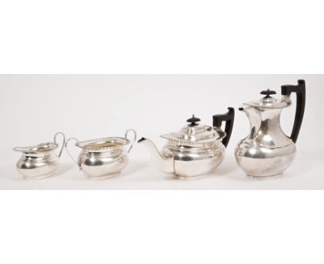 1930s four piece silver tea set - comprising teapot of compressed baluster form, with egg and dart border, angular ebony hand