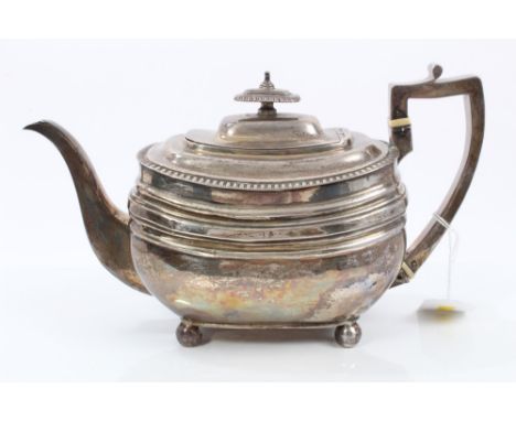 George III silver teapot of rectangular cauldron form, with raised belts of decoration and ovoid border, silver handle with i