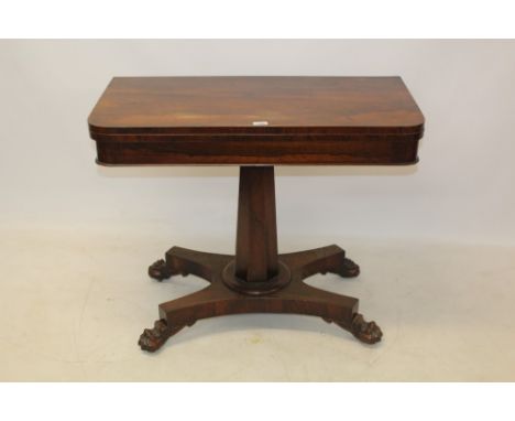 William IV rosewood card table, the rounded rectangular fold-over top with baize-lined playing surface and well below, raised