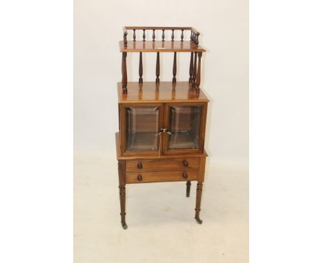 Victorian mahogany music cabinet with shelf superstructure raised on spindle gallery, enclosed below by pair of glazed doors 