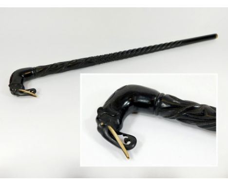 WALKING STICK. An ebony & bone carved walking stick, possibly Ceylonese. Length 91cm.  Please note that all items in this auc