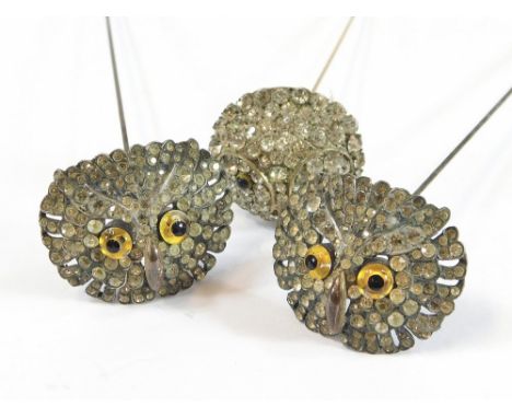 OWL HAT PINS. A pair of paste set, hinged metal owl hat pins & one other similar hat pin. Longest 26.5cm.  All hatpins are in